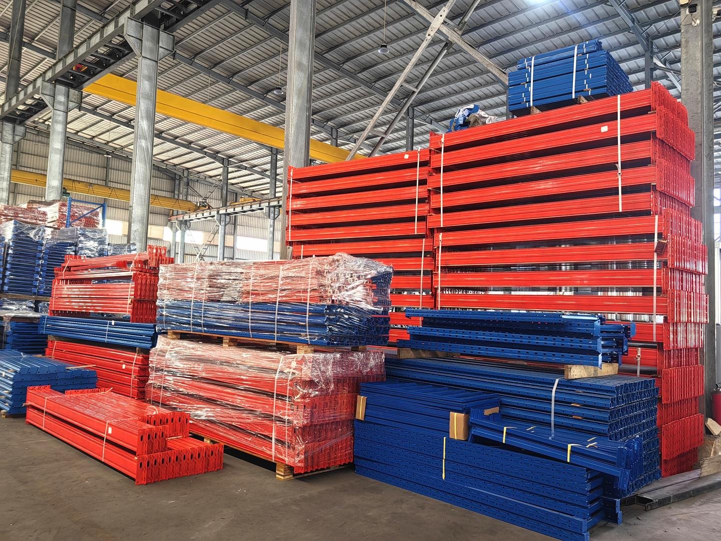 Wrapped red and blue racking bundles on the factory floor